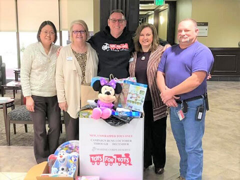CS council poses around Toys for Tots donations.